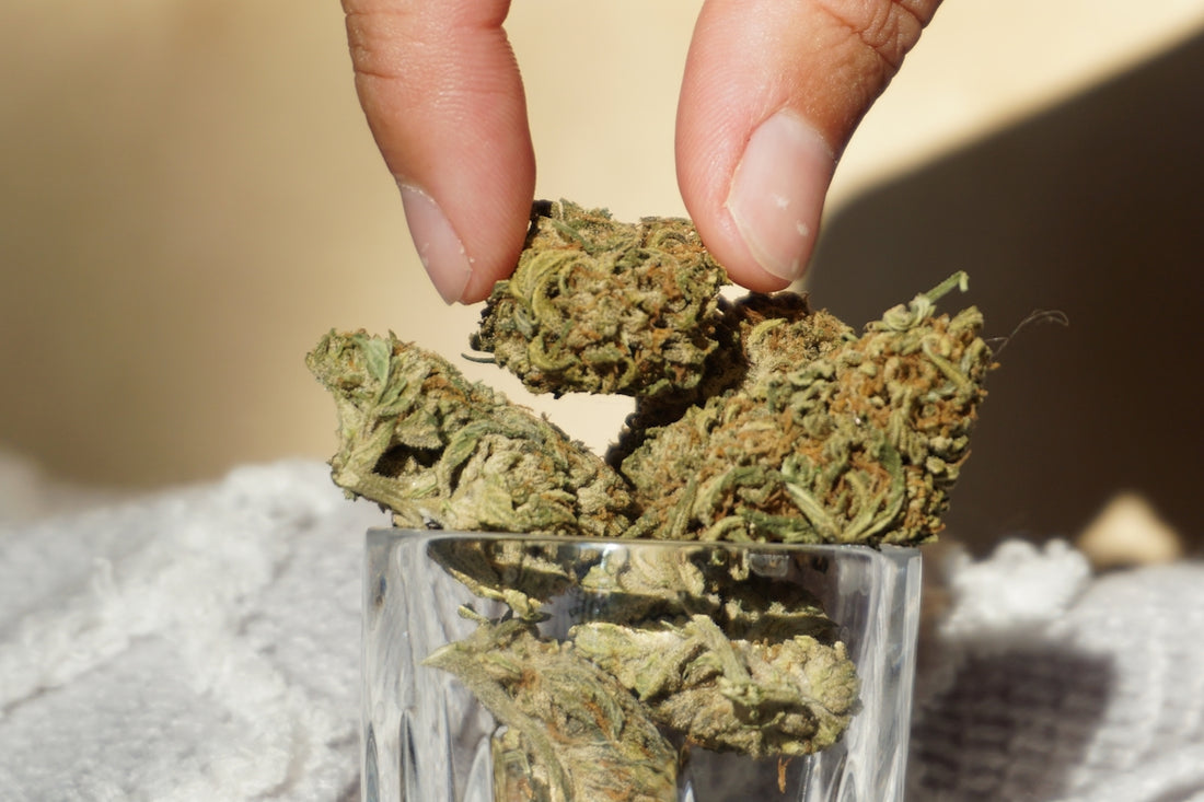 green kush in clear glass container
